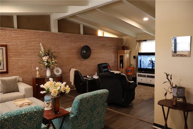 109 Kissling Ave, Robstown, TX 78380 - living room with lofted ceiling with beams, brick wall, and wood finished floors