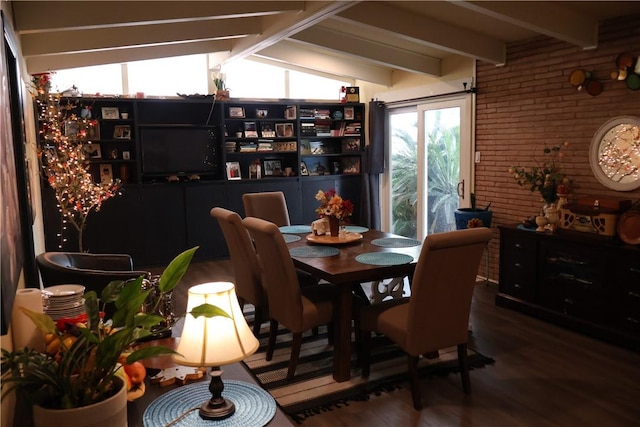 109 Kissling Ave, Robstown, TX 78380 - dining area featuring lofted ceiling with beams, wood finished floors, and brick wall