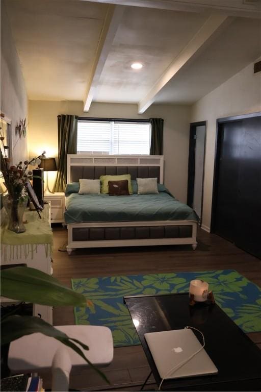 109 Kissling Ave, Robstown, TX 78380 - bedroom featuring visible vents, vaulted ceiling with beams, and wood finished floors