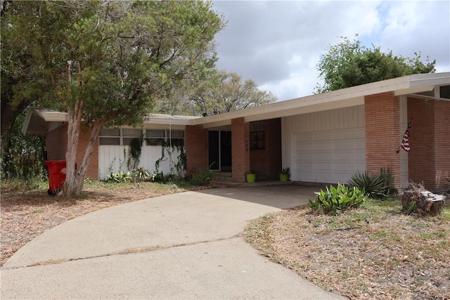 109 Kissling Ave, Robstown, TX 78380 - view of front of property featuring driveway, a garage, and brick siding