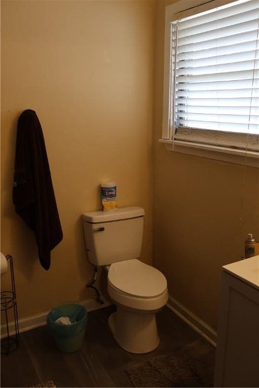 109 Kissling Ave, Robstown, TX 78380 - half bath featuring toilet, vanity, and baseboards
