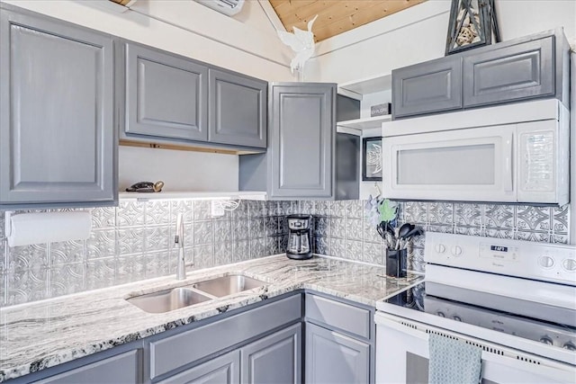 kitchen with sink, white appliances, and gray cabinets