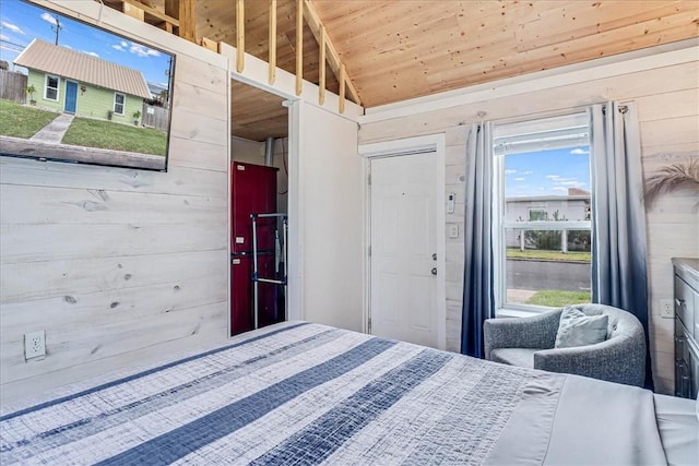 bedroom with wood walls, wood ceiling, and vaulted ceiling