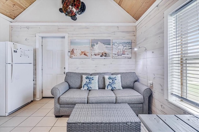 living room featuring light tile patterned flooring, wood ceiling, and wooden walls