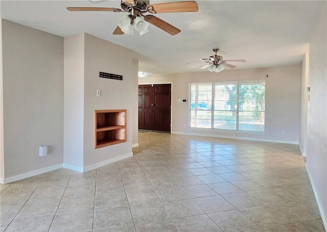 unfurnished living room with ceiling fan and light tile patterned flooring