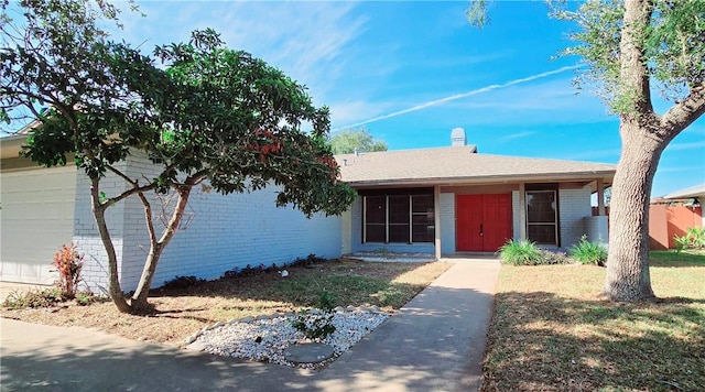 ranch-style house featuring a garage