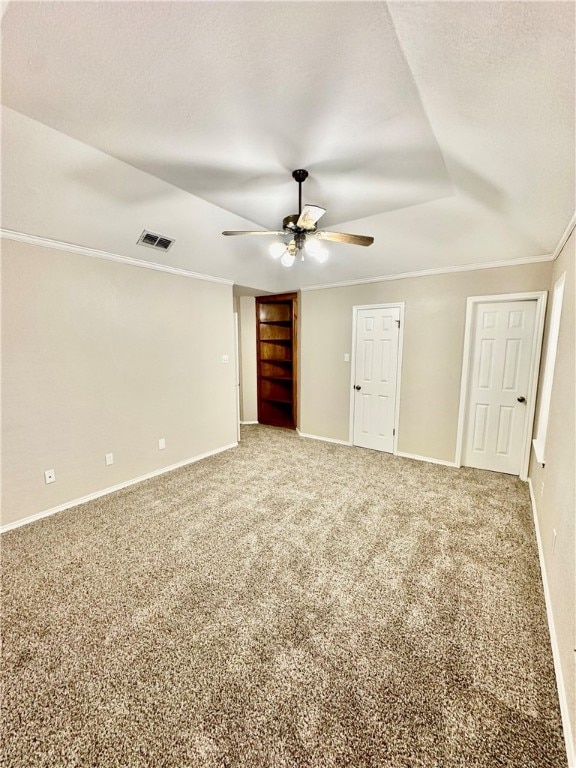 carpeted spare room featuring ornamental molding and ceiling fan