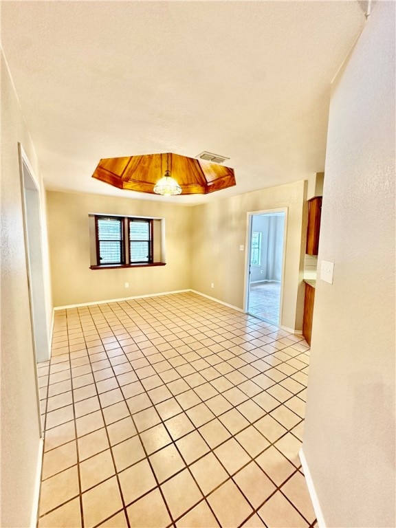 empty room with light tile patterned flooring