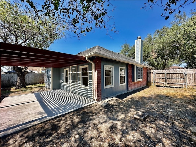 rear view of property featuring a patio