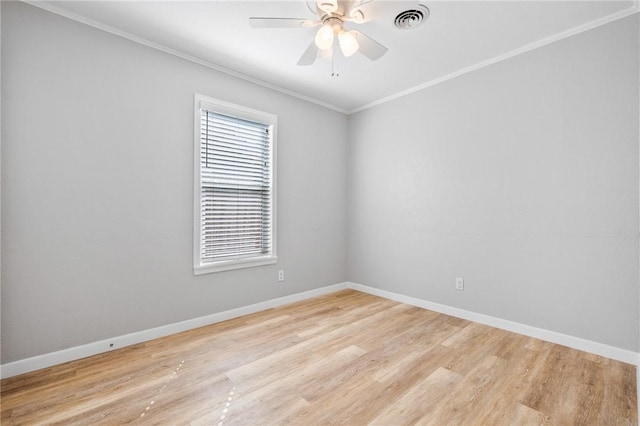 unfurnished room featuring visible vents, crown molding, light wood-type flooring, and baseboards