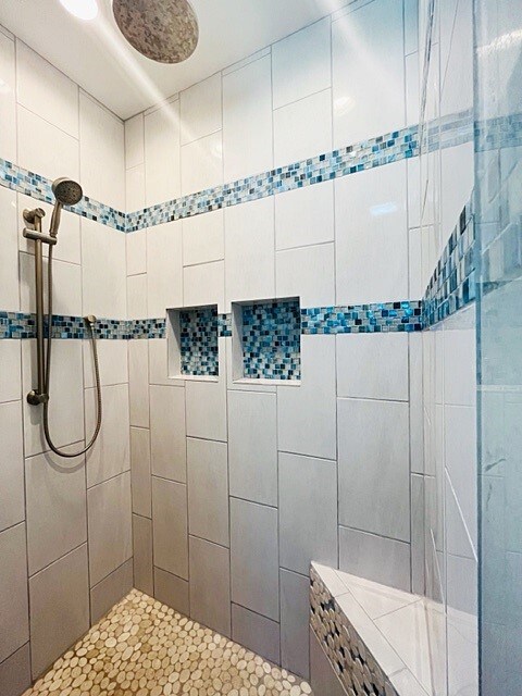 bathroom with tiled shower