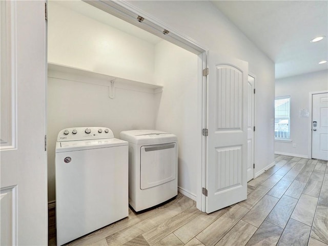 175 Five Dove Prt, Aransas, TX 78373 - laundry room with washer and dryer, wood tiled floors, recessed lighting, and baseboards
