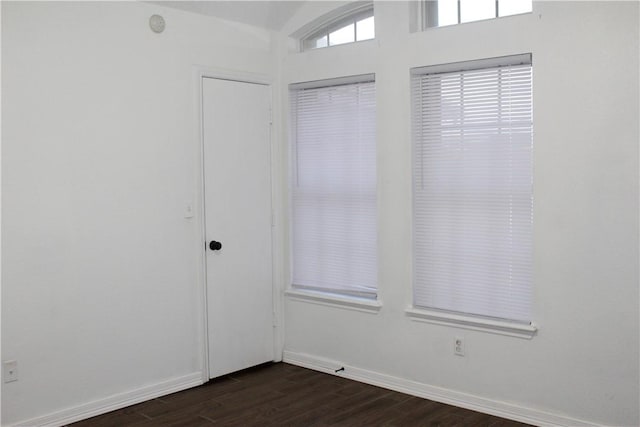 empty room featuring dark hardwood / wood-style floors