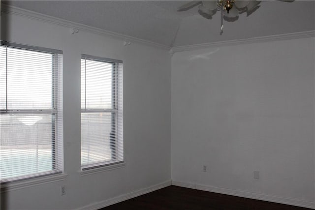 spare room featuring ceiling fan, ornamental molding, dark hardwood / wood-style floors, and plenty of natural light