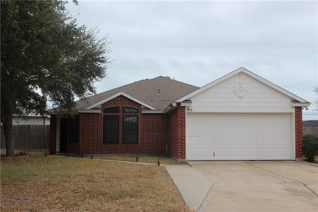 ranch-style home with a garage and a front yard