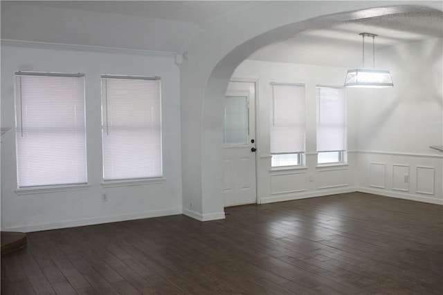 entryway featuring dark hardwood / wood-style flooring and ornamental molding