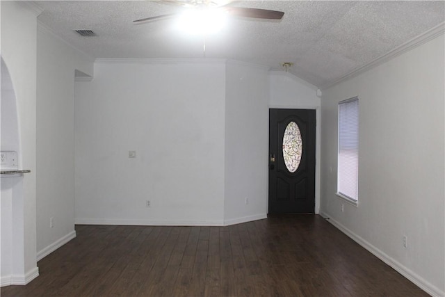 entryway featuring ornamental molding, vaulted ceiling, and dark wood-type flooring