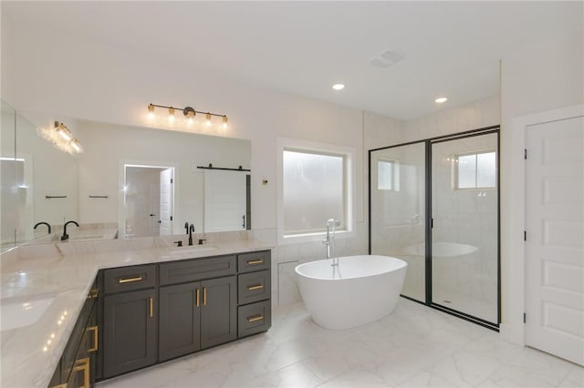 bathroom with vanity, separate shower and tub, and tile walls