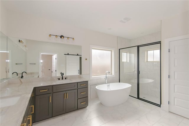 bathroom with plus walk in shower, tile walls, and vanity