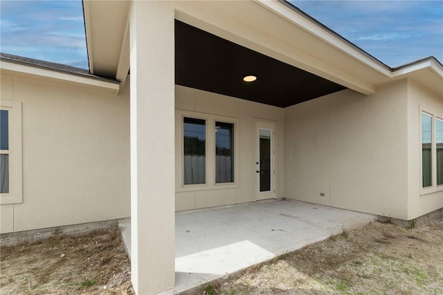 property entrance with a patio area