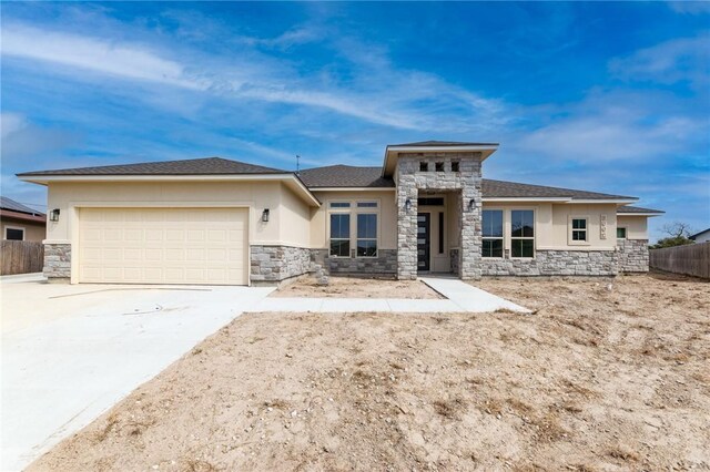 prairie-style house featuring a garage