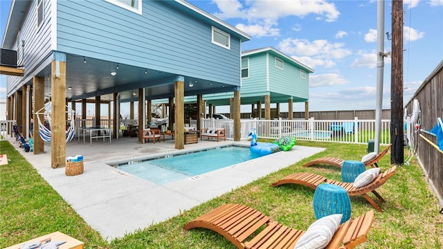 view of swimming pool with a yard, a patio, and an outdoor hangout area