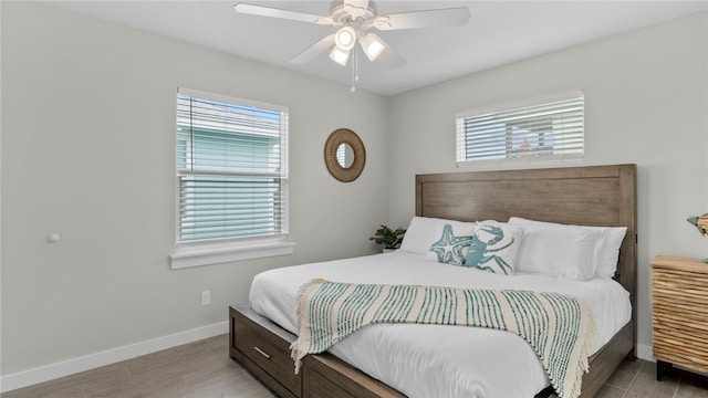 bedroom with ceiling fan and light hardwood / wood-style flooring