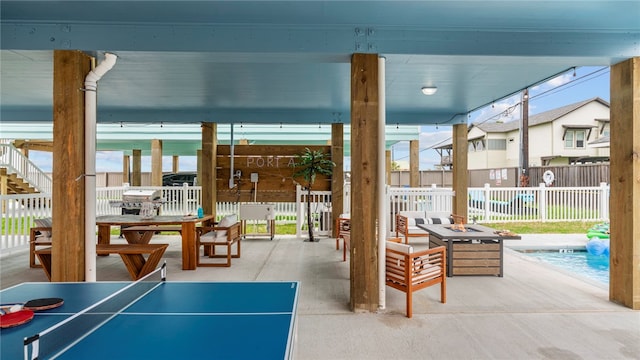 view of patio / terrace featuring an outdoor fire pit