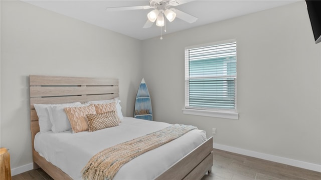 bedroom featuring light hardwood / wood-style floors and ceiling fan