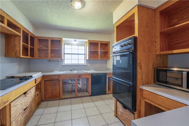 kitchen with black appliances, open shelves, and light countertops