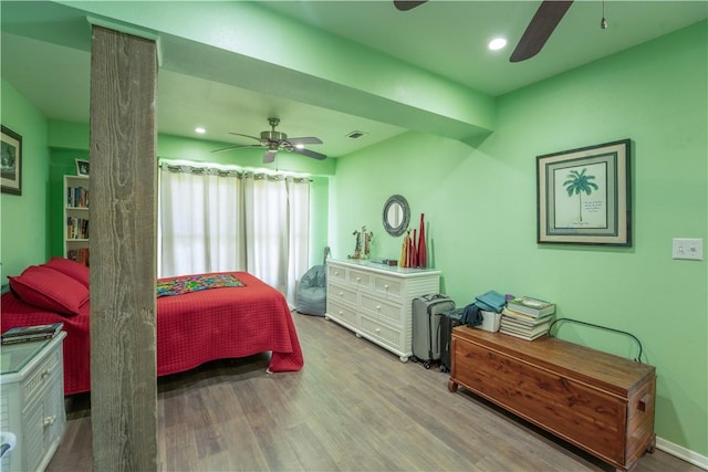 bedroom with a ceiling fan, wood finished floors, visible vents, and recessed lighting