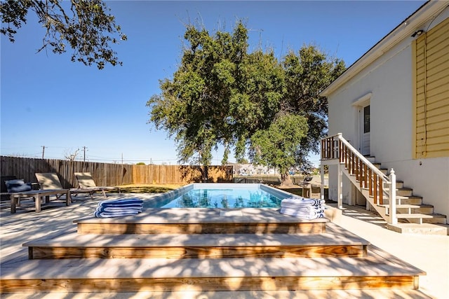 view of pool with a wooden deck