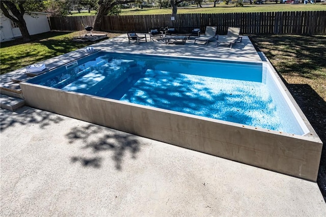 view of pool with an outdoor living space and a patio