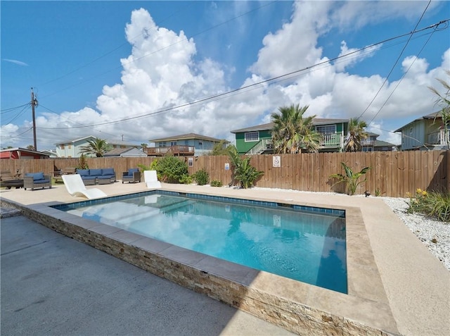 view of pool featuring an outdoor living space and a patio