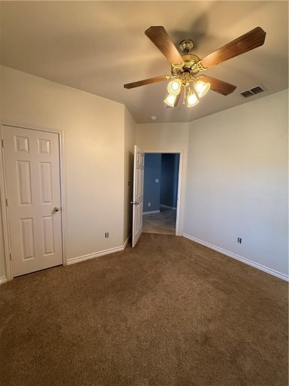 unfurnished bedroom with carpet and ceiling fan