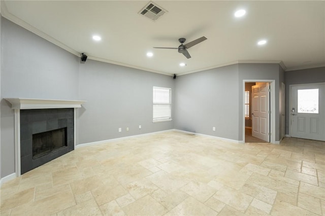 unfurnished living room with crown molding, ceiling fan, and a fireplace