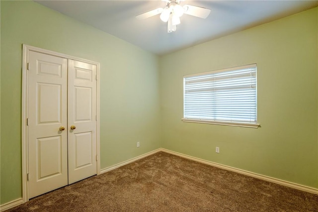 unfurnished room featuring carpet floors and ceiling fan