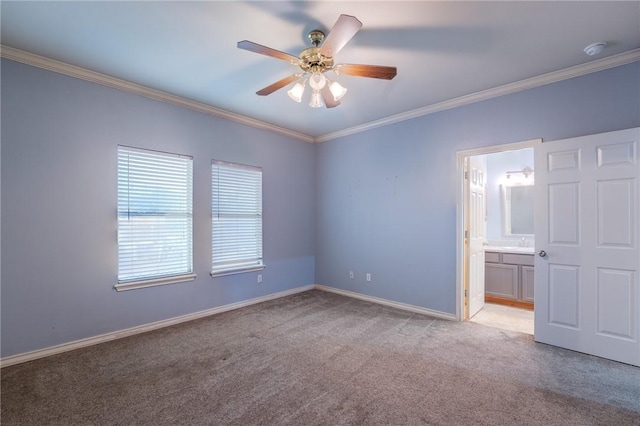 unfurnished bedroom featuring sink, ensuite bath, ceiling fan, ornamental molding, and light colored carpet