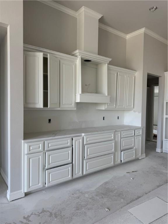 kitchen with ornamental molding, white cabinets, baseboards, and open shelves