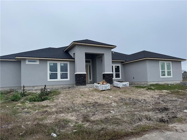 prairie-style home with stucco siding