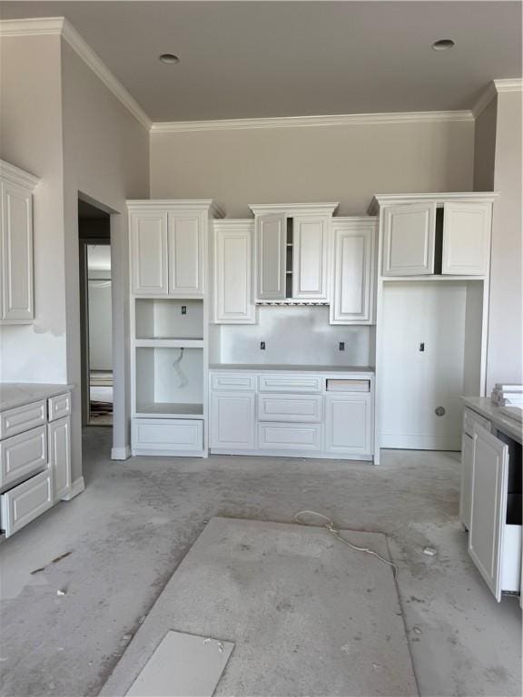 kitchen with white cabinetry, open shelves, and crown molding