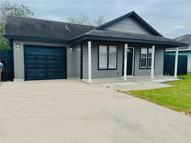 view of front of property with a porch and a garage