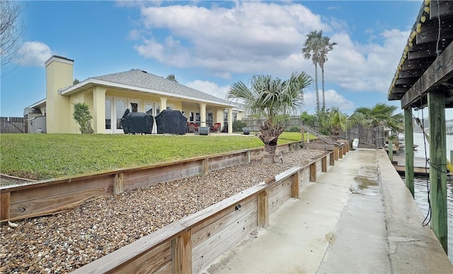 view of home's exterior with a yard