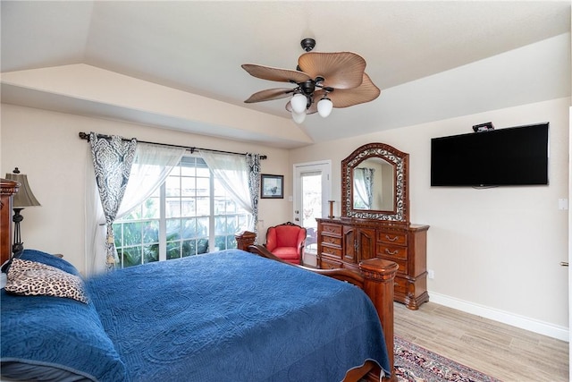 bedroom featuring ceiling fan, lofted ceiling, and light hardwood / wood-style floors