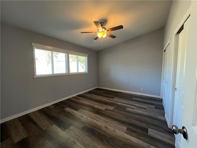 unfurnished bedroom with ceiling fan and dark hardwood / wood-style floors