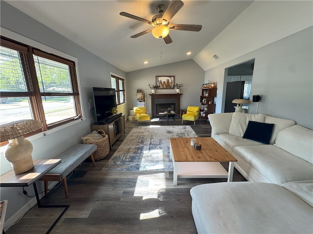 living room featuring ceiling fan, dark hardwood / wood-style flooring, and lofted ceiling