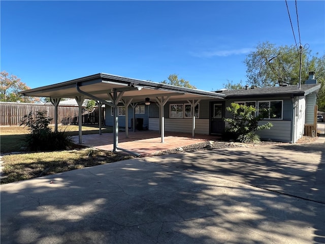 view of front of property featuring a carport