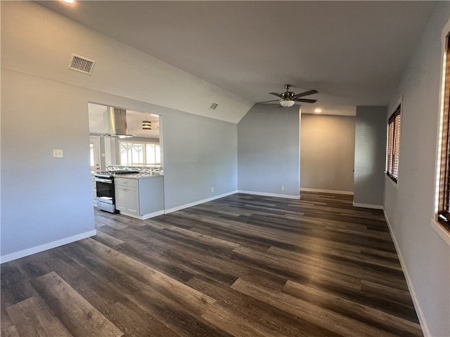 unfurnished living room with dark hardwood / wood-style flooring, ceiling fan, and lofted ceiling