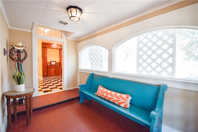 sitting room featuring ornamental molding