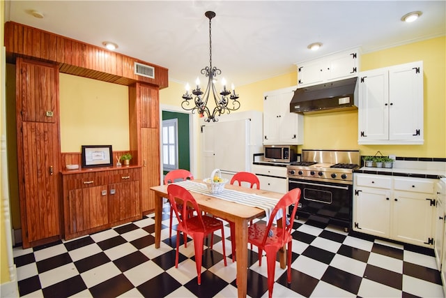 dining space featuring ornamental molding and a chandelier